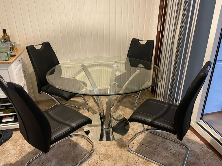 Glass dinning table with 4 chairs 