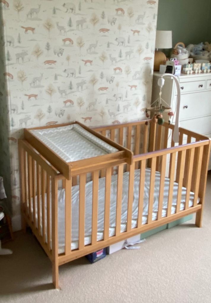 Cot bed with changing table 
