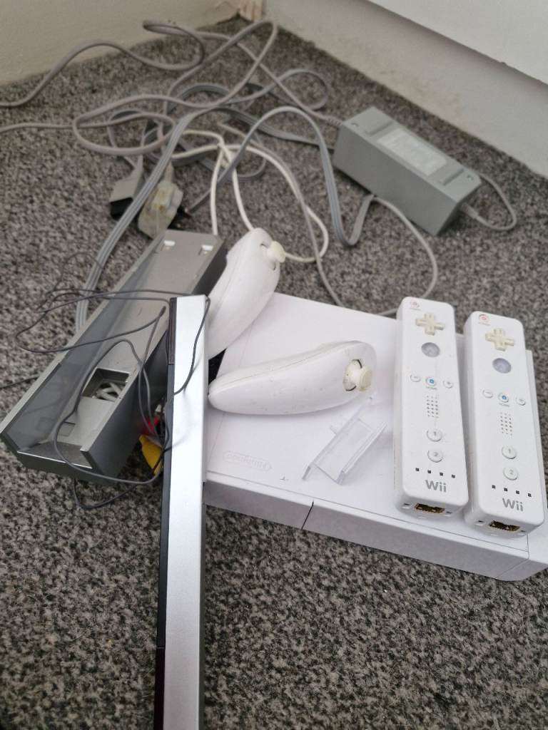 White nintendo wii and games