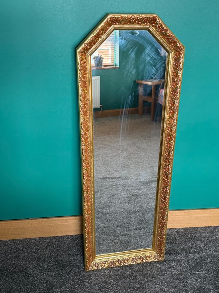 Tall beautiful mirror in decorative golden -ish frame