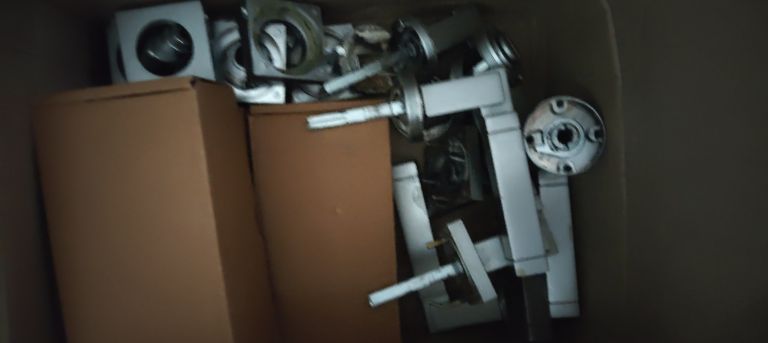 Box full of same door handles 