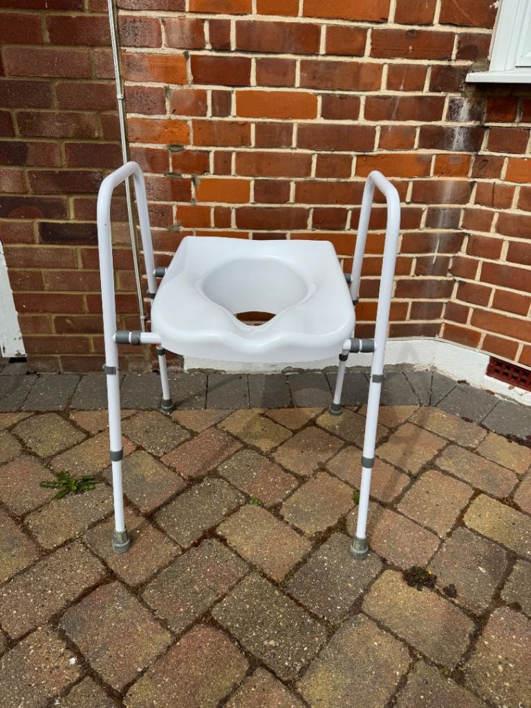 Toilet frame /. Chair with arms 