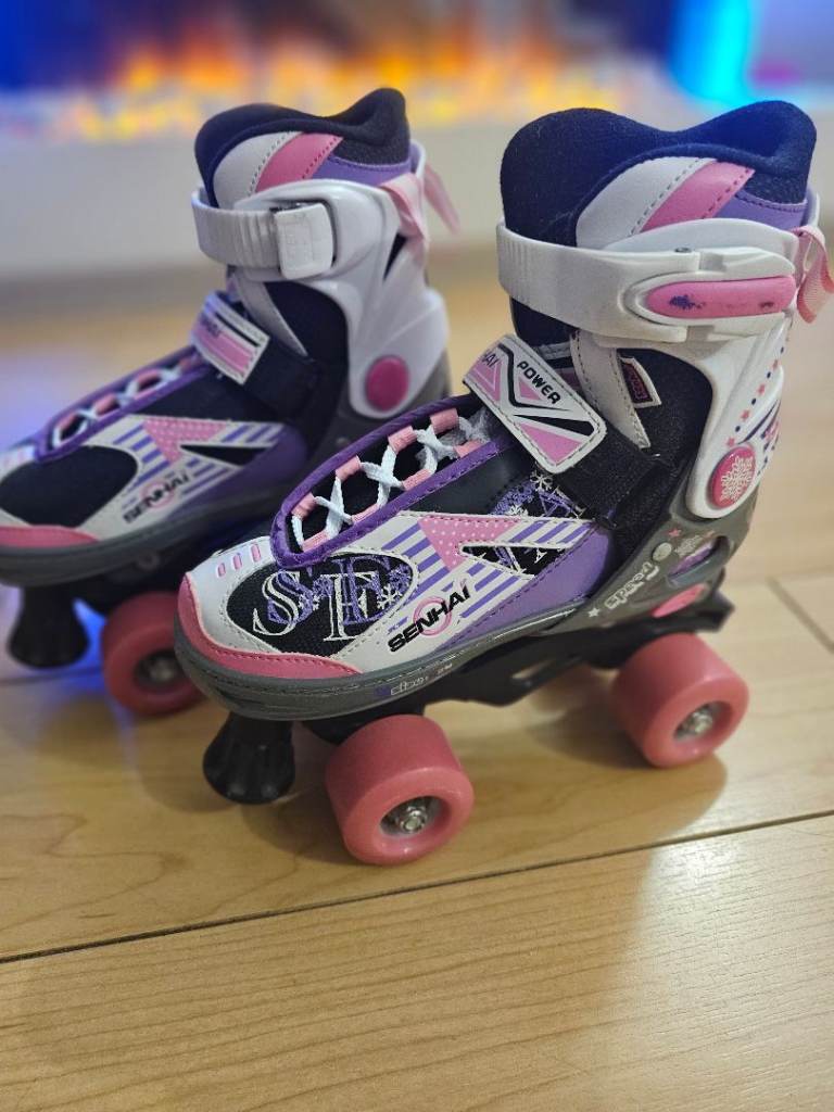 Senhai Adjustable Roller Skates. Size EU33-36, UK 1-3.