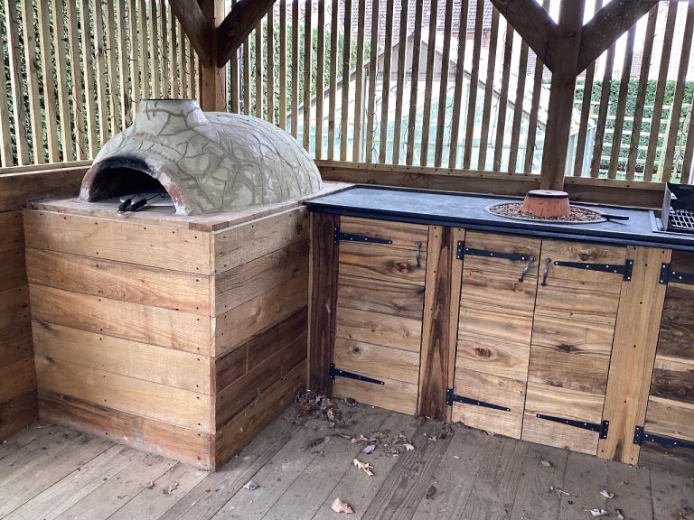 Outdoor kitchen with clay pizza oven