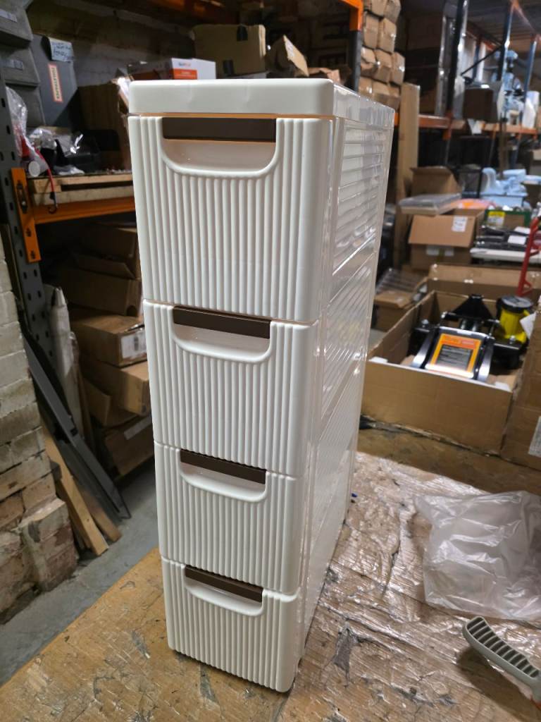 A new off white and brown pladtic 4 drawer storage unit .