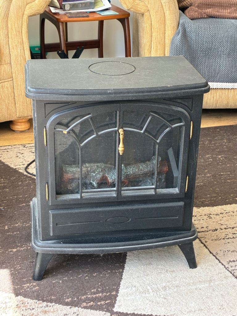 Log burner effect electric fire plus surround. WILL SELL SEPARATELY 