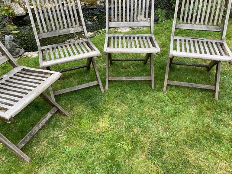 Set of four solid wood garden chairs. Fiver a chair. 