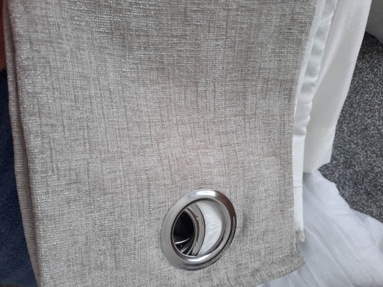 Grey eyelet curtains fully lined