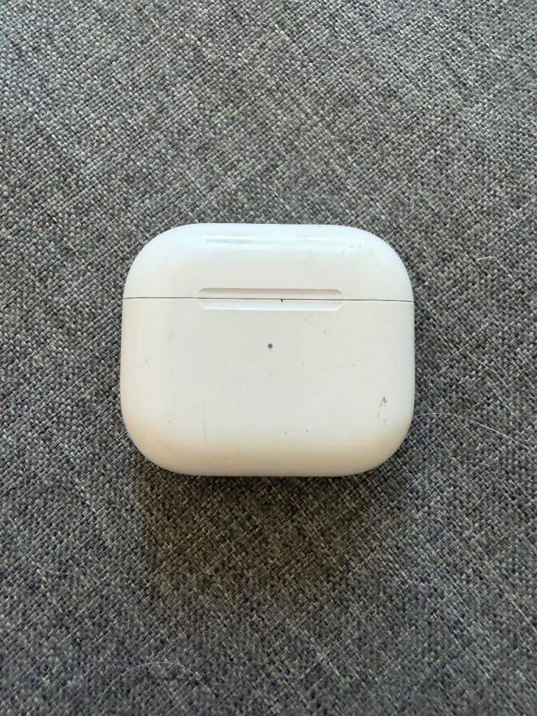 Apple AirPods with Charging Case – Good Condition