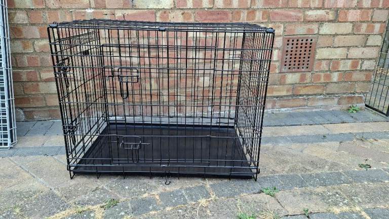 Black metal folding dog crate