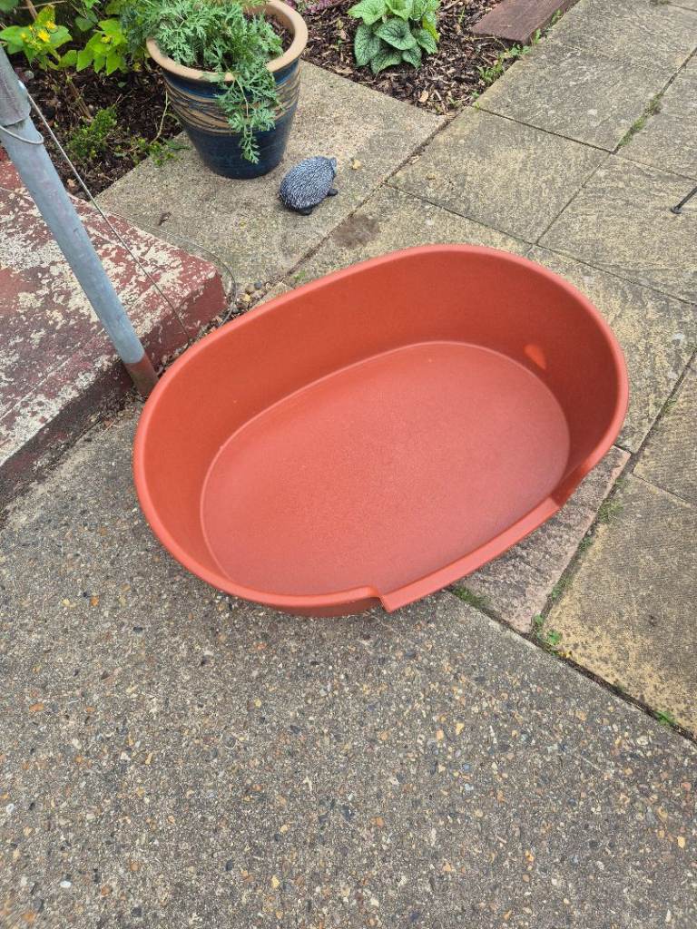 Plastic dog bed. Brown colour