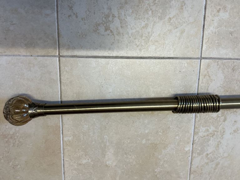 Burnished gilt metal curtain pole
