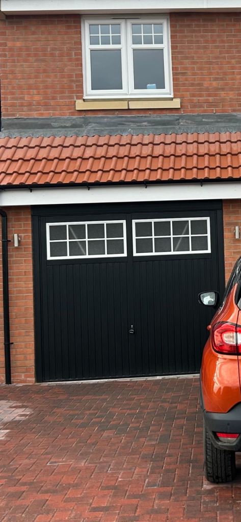 Up and over black garage door