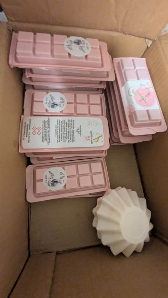 Bundle of ready made wax melts and unused empty bottles 