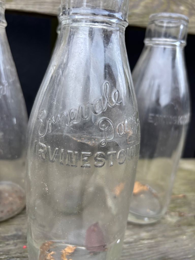 9 old glass milk bottles 