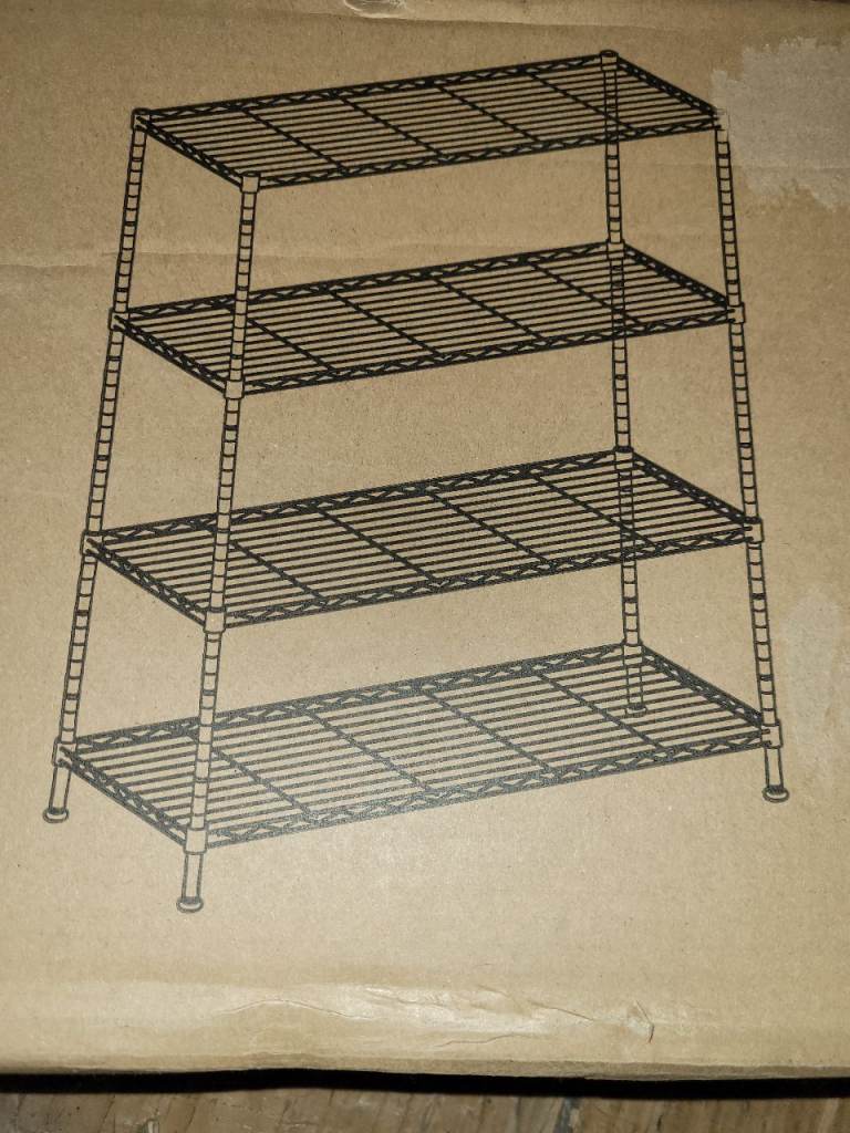 A new still boxed flat packed black metal Storage Shelf, Metal Garage Shelving Unit. 