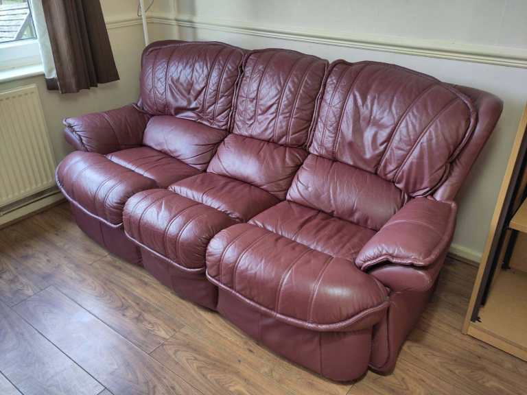 Maroon faux leather 3-seater sofa and matching armchair