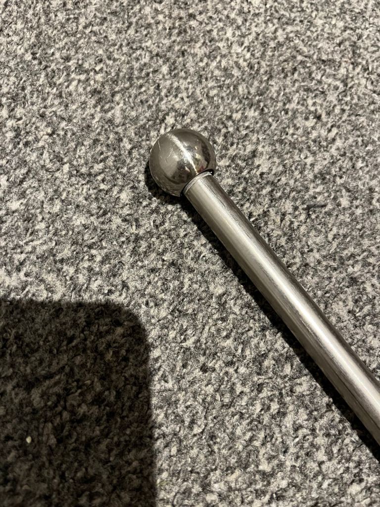 Silver extendable curtain pole