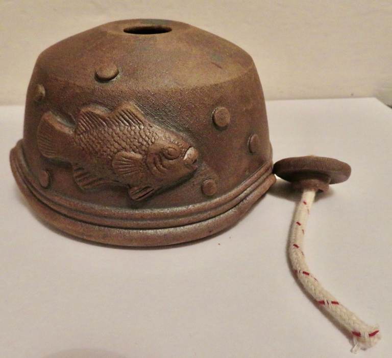 Handmade ceramic oil lamp with fun fish design