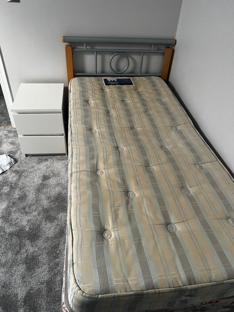 Single bed with headboard