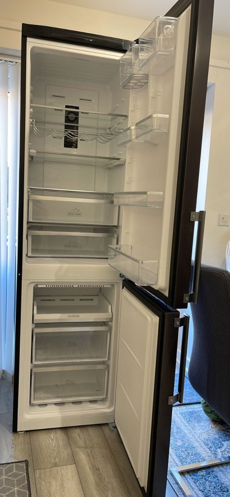 Hot point fridge freezer one years old in excellent condition 60 cm wide 2 m high 