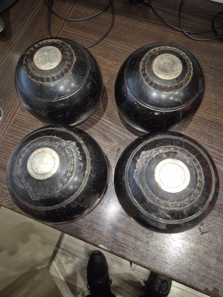 Vintage lawn bowls in leather case 