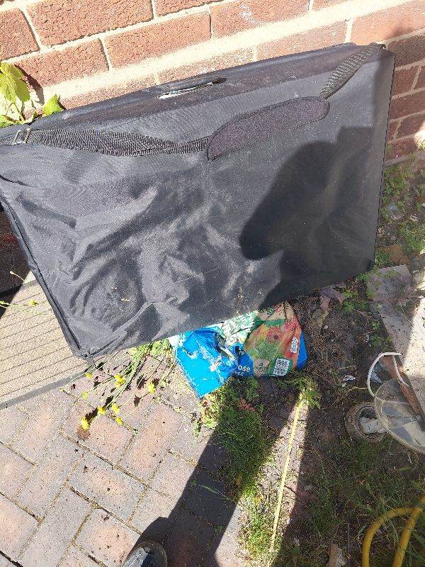 Massage table in a carrier bag.