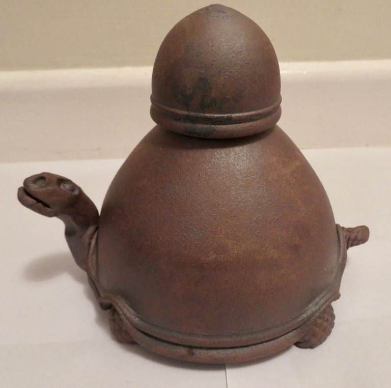 Handmade ceramic oil lamp in shape of a tortoise, with cover for wick. As new