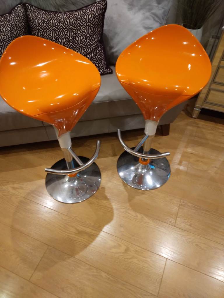 PAIR OF BAR STOOLS ORANGE AND WHITE  ON CHROME BASE £30 THE PAIR 