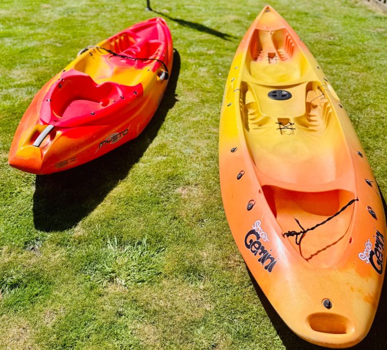 Two kayaks with  4 removable seats  3 paddles and  2 life jackets & 6 bungs 