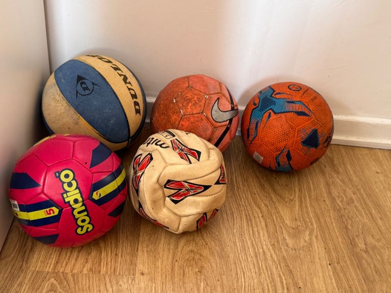Selection of Used Footballs and a Basketball – Fair Condition