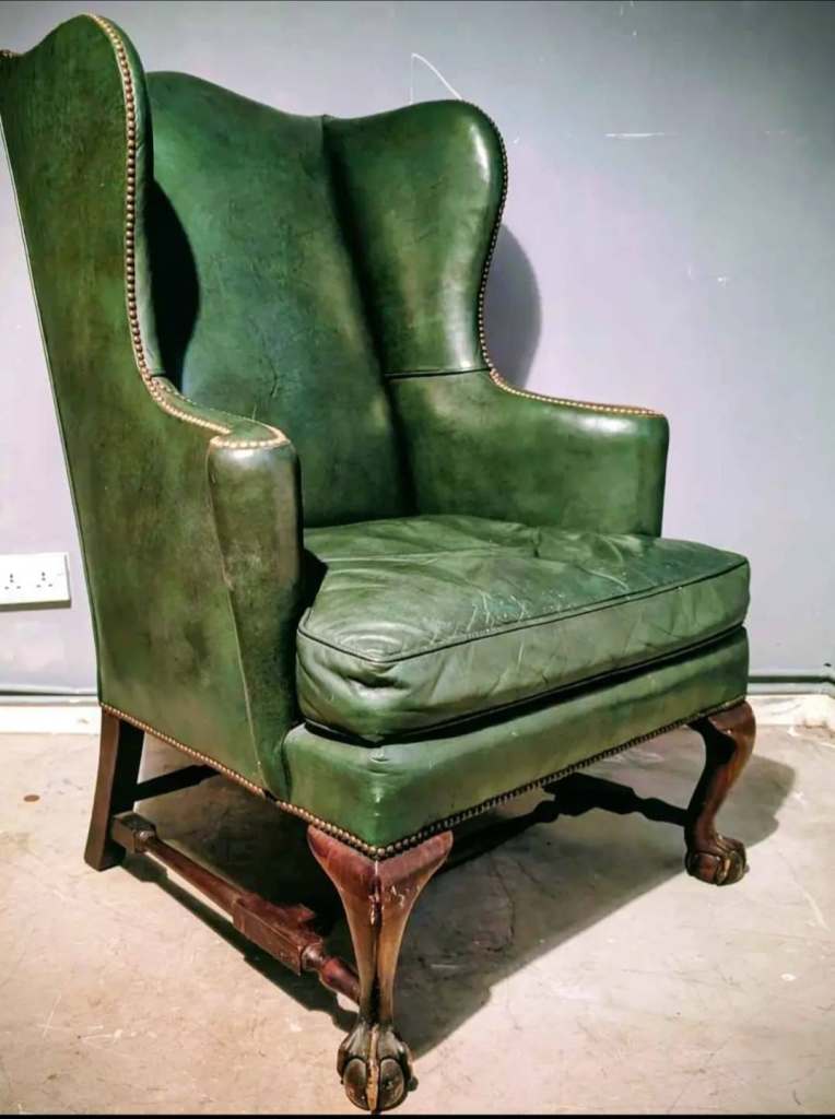 A beautiful antique wing chair by baker furniture.
