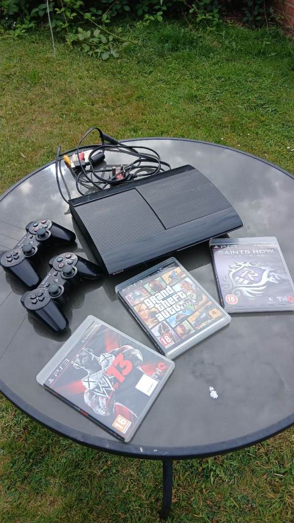 PlayStation 3 with two controllers and three games , good condition,  ps3 