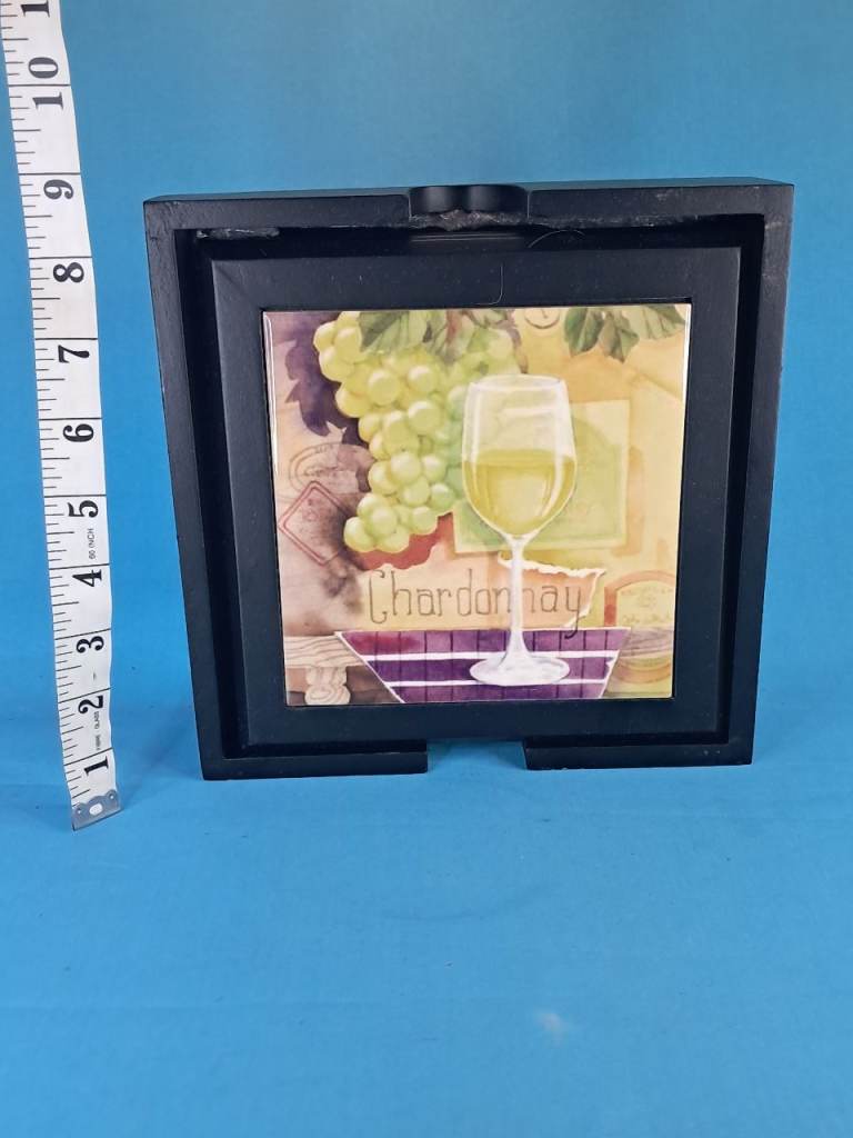 This is a  4peaces of set framed decorative tiles featuring illustrations of wne glasses.
