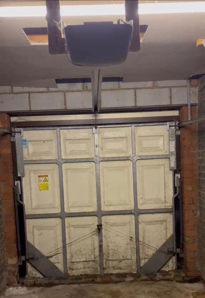 Remote controlled electric garage door opener 