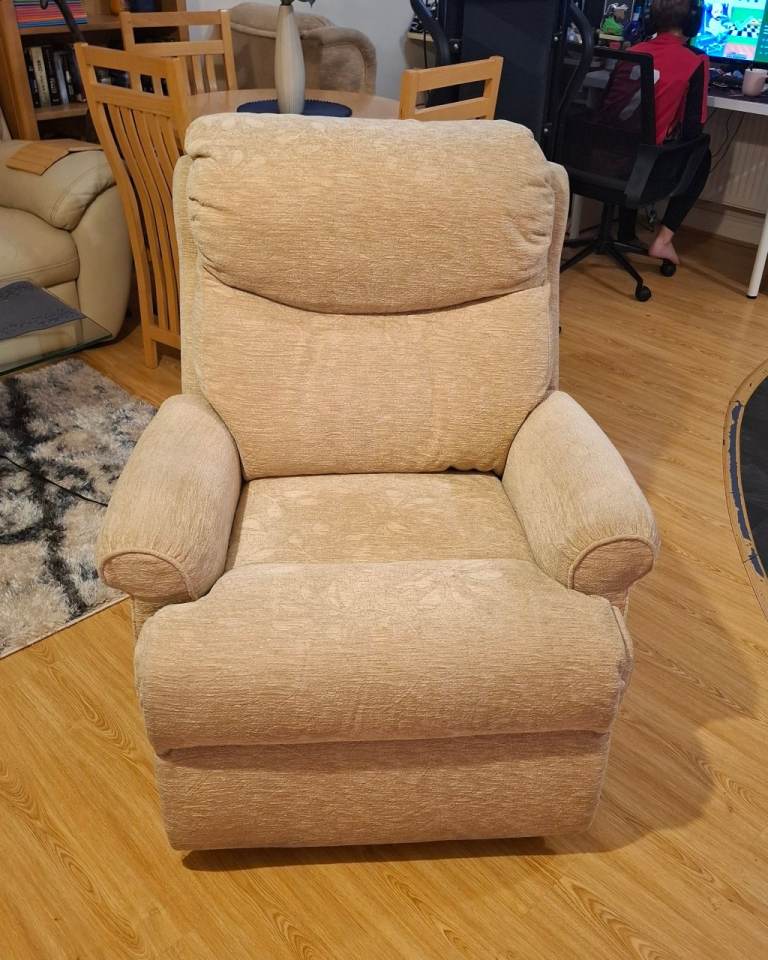 Beige electric reclining armchair