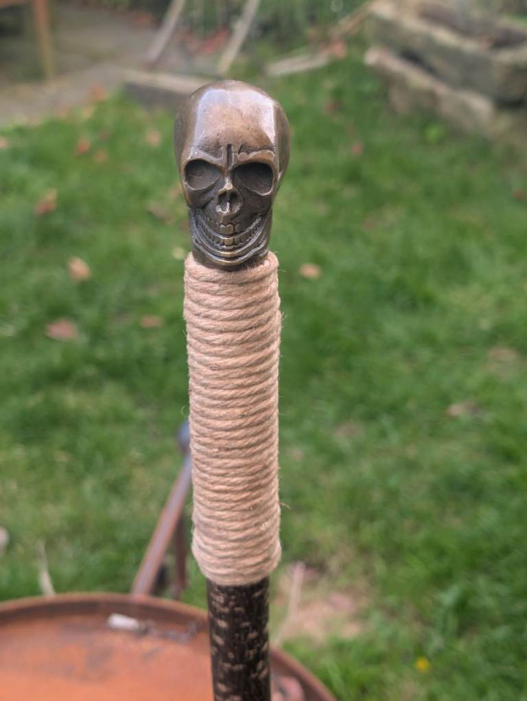 Brass skull on hazel staff