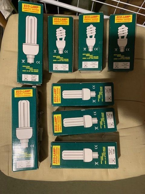 Unused and boxed Energy Saving Light Bulbs.