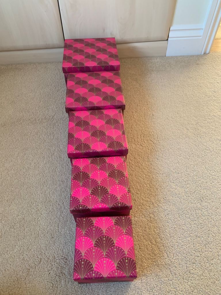 Beautiful set of five pink and gold boxes