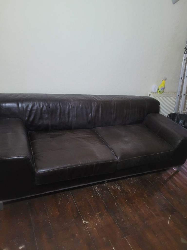 Free. 2 large brown faux leather sofas