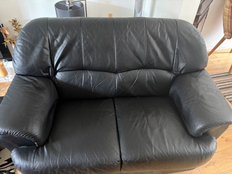 Two two seater leather sofas