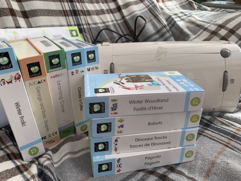 Cricut machine with 9 cartridges