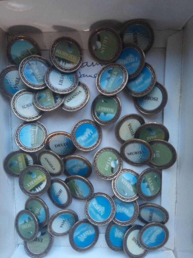 Golf ball markers with personal names on 