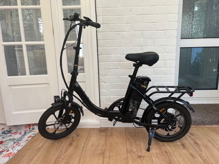 Folding electric bike - as new with new spare battery 