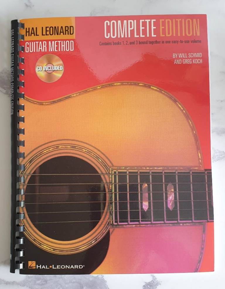 Hal Leonard method for playing guitar - 3 books in one plus 3 CDs. 