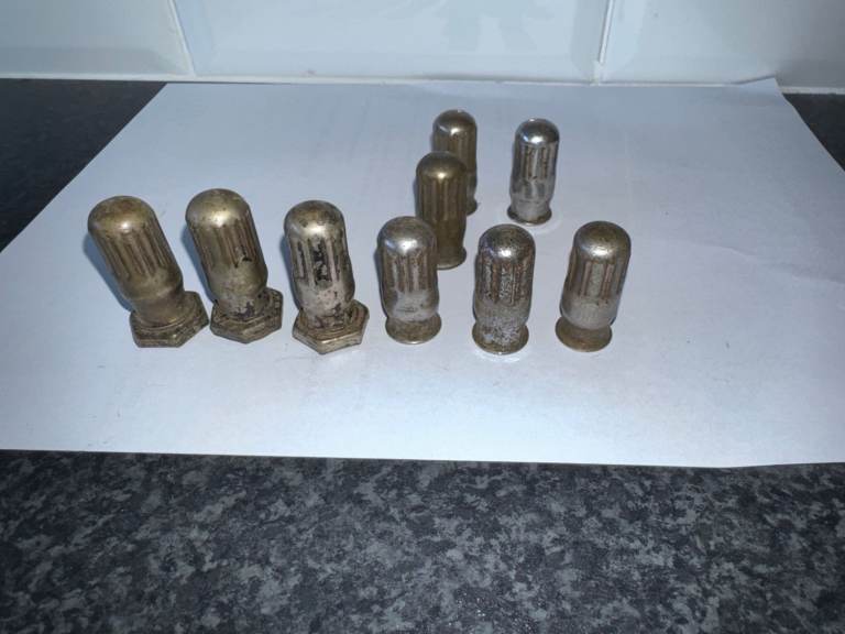 old pre war car tyre  valve caps