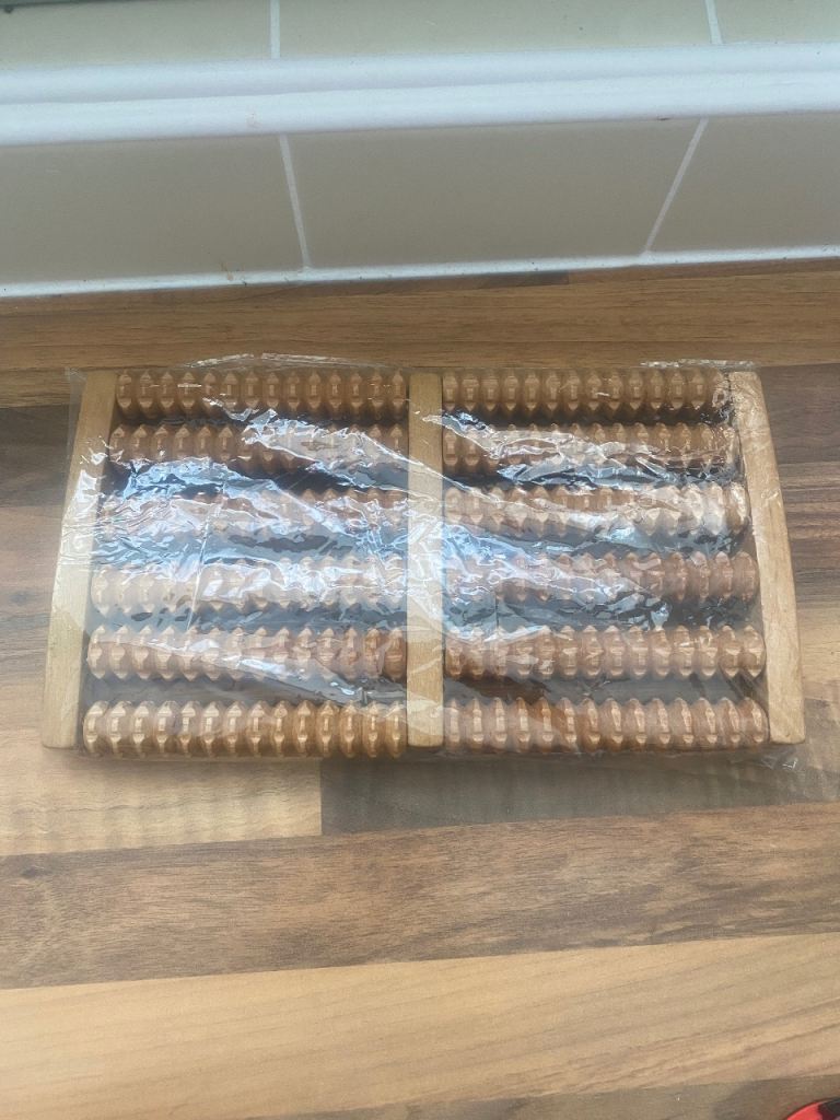 12 roller wooden foot massager . 