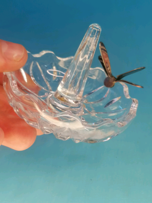 Glass ring holder with butterfly on  a side..
