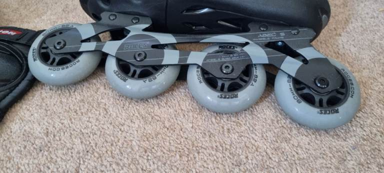 image for Kids Black Inline Roller blades - UK Size (42) with helmet and protective gears