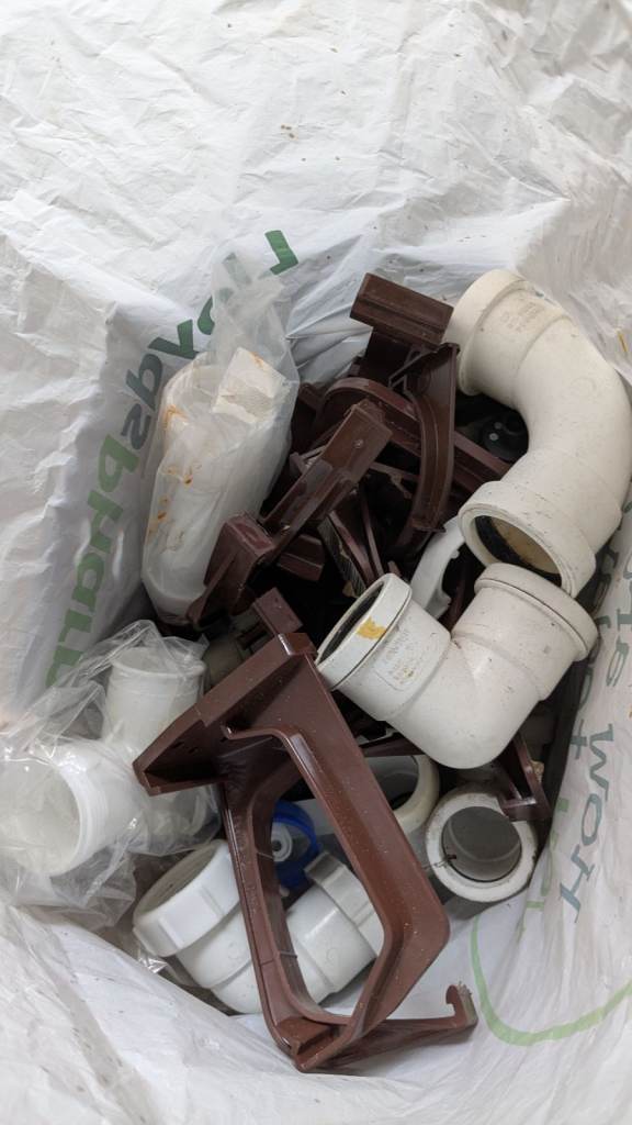 Bag of Plumbing items, guttering brackets +Plastic pipe 36mm 